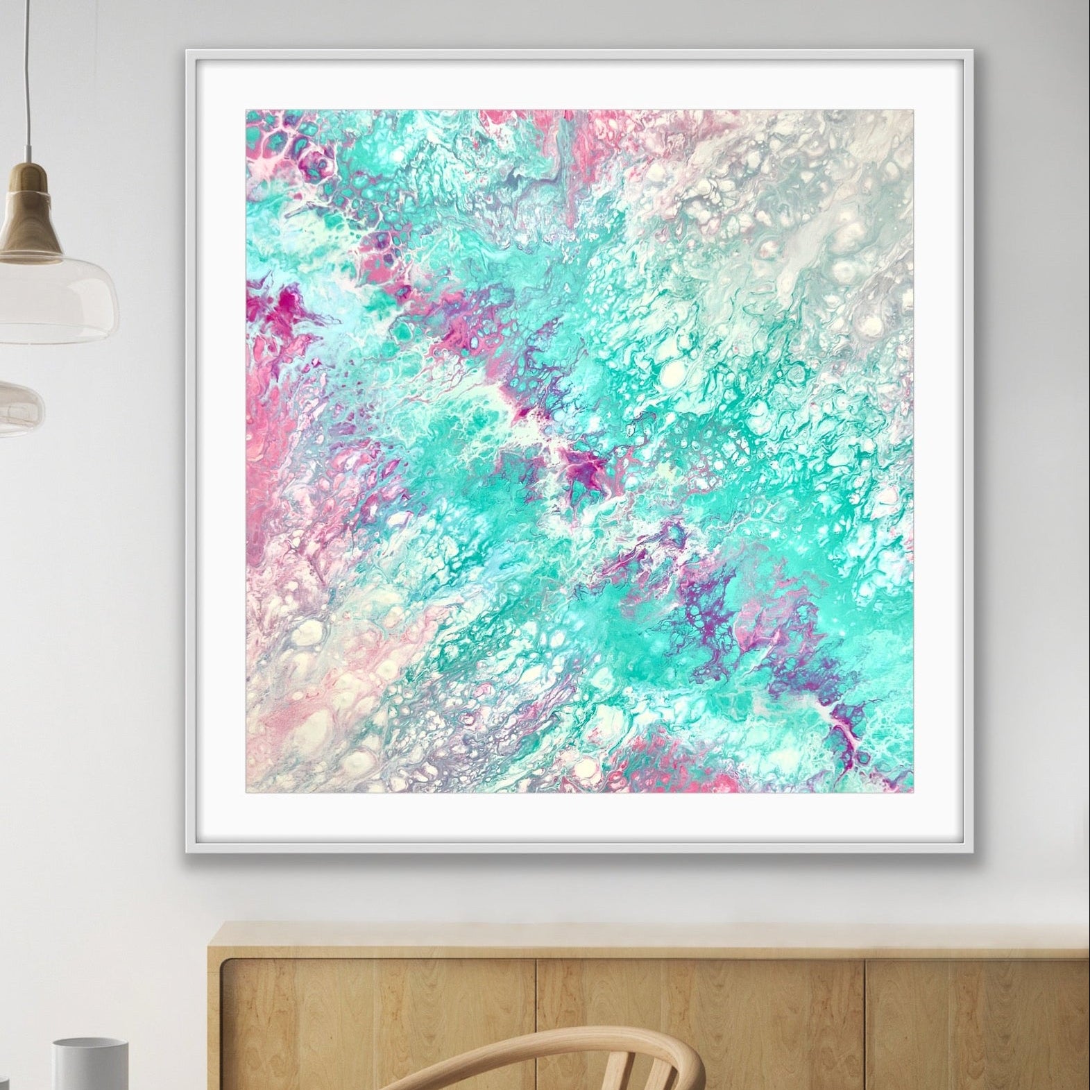 Framed abstract artwork with pastel colours in aqua and pink